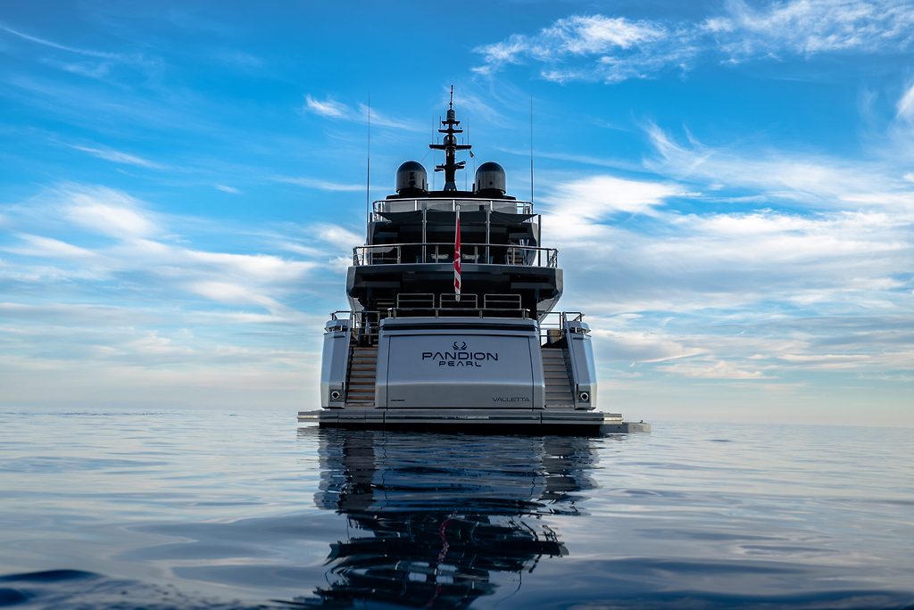 Motor yacht "Pandion Pearl" stern view, at rest on calm open water