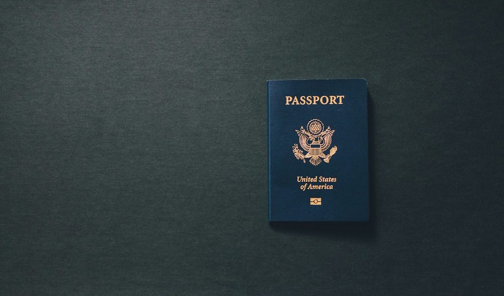 United States passport lying on a dark surface