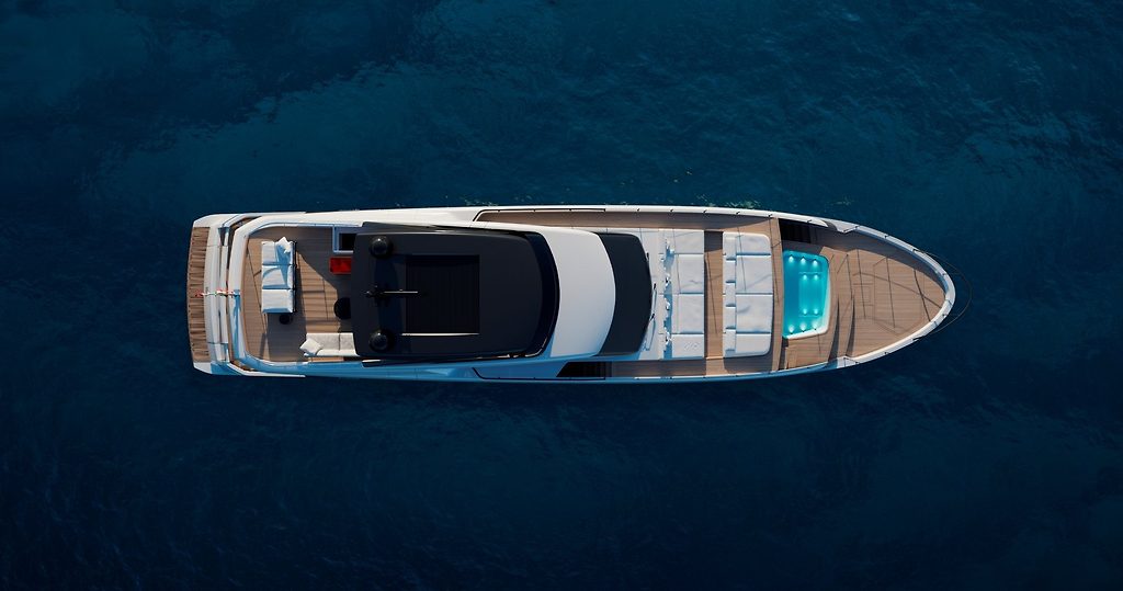 Yate a motor visto desde arriba, anclado en aguas abiertas