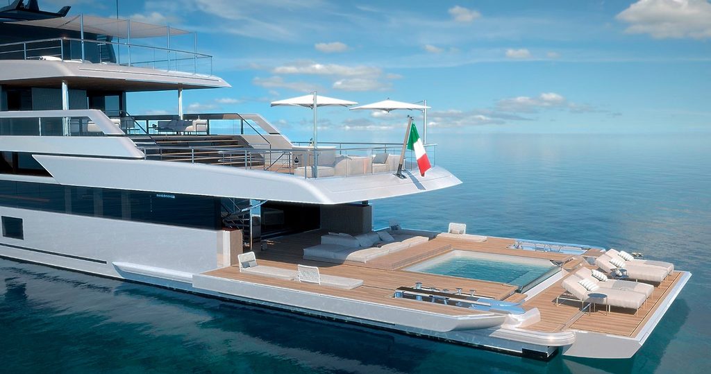 Pont arrière d'un superyacht avec piscine et mobilier lounge, à l'ancre en mer