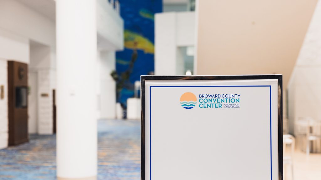 Sign with the Broward County Convention Center logo in a lobby, Greater Fort Lauderdale